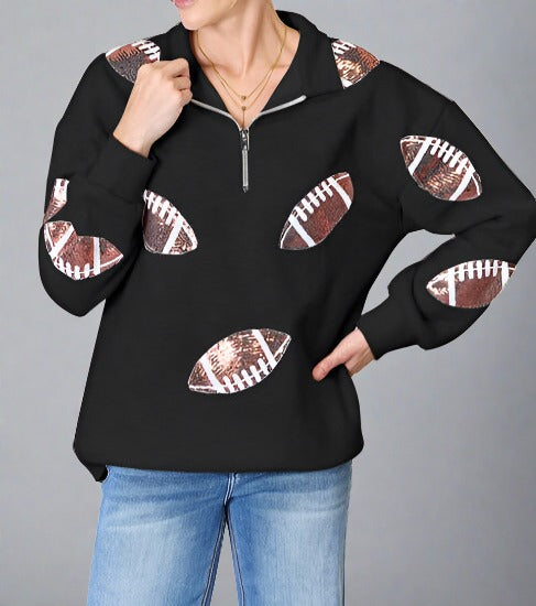 Black half zip pullover with sequin football patches on front and sleeves
